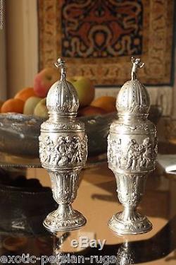 A Pair of 800 silver Antique Karl Sohnlein & Sohne Putti casters salt and pepper