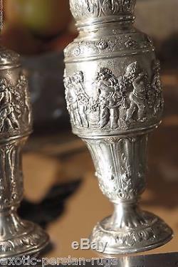 A Pair of 800 silver Antique Karl Sohnlein & Sohne Putti casters salt and pepper
