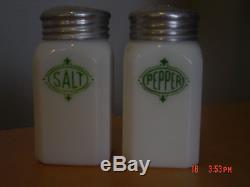 Milk glass salt and pepper shakers original lids