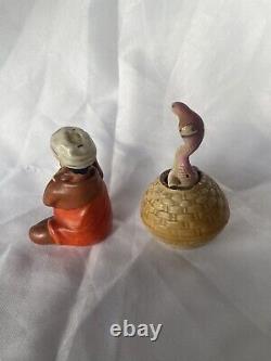 Vintage porcelain charmer and snake salt and pepper shakers