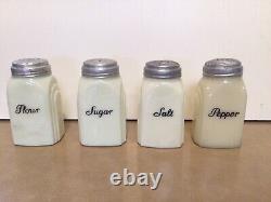 Vintage salt and pepper, flour and sugar shakers